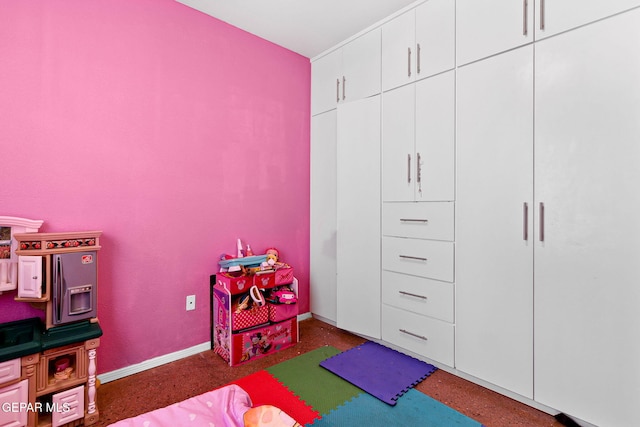 bedroom featuring baseboards