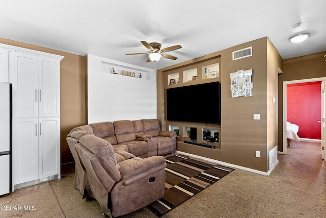 living area with visible vents, light speckled floor, baseboards, and ceiling fan