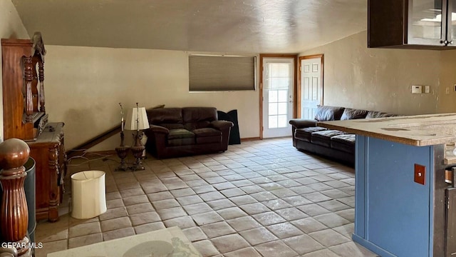 living area featuring light tile patterned floors