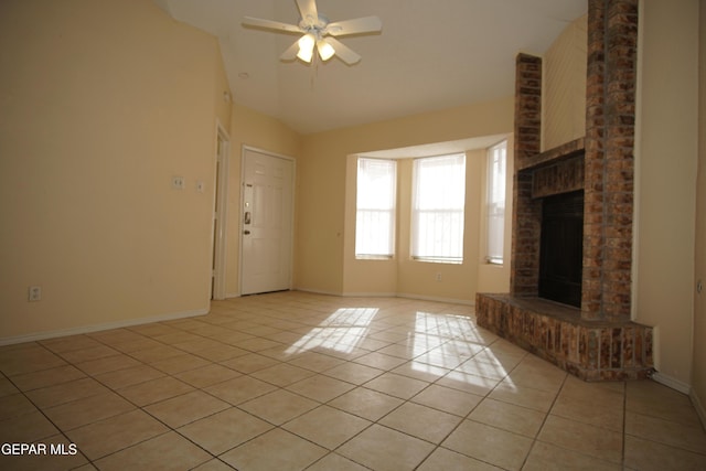 unfurnished living room with light tile patterned floors, a brick fireplace, baseboards, and a ceiling fan