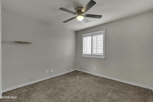 unfurnished room with baseboards, carpet, visible vents, and ceiling fan