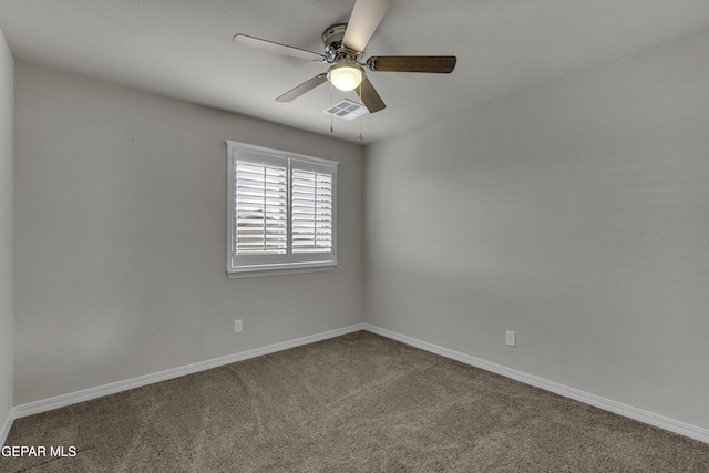 unfurnished room with visible vents, baseboards, carpet flooring, and a ceiling fan