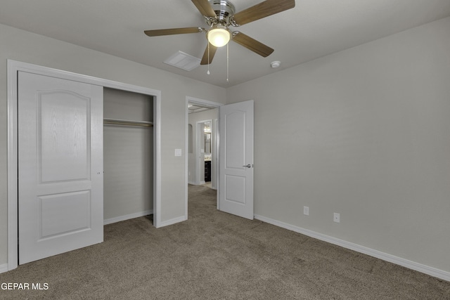 unfurnished bedroom with a ceiling fan, carpet flooring, baseboards, and a closet