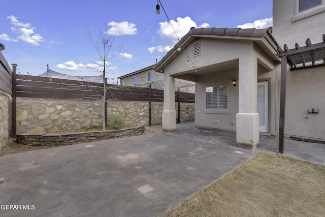 view of patio / terrace with fence