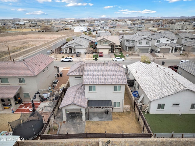 birds eye view of property with a residential view