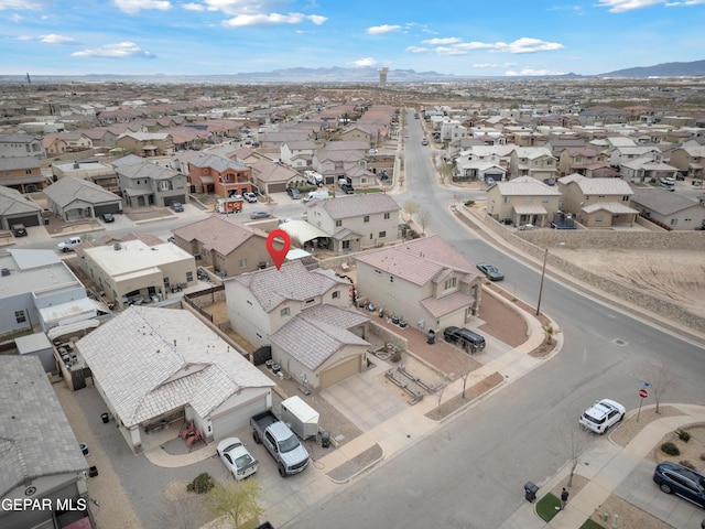 birds eye view of property featuring a mountain view and a residential view