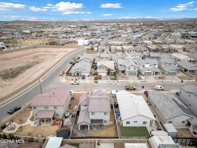 birds eye view of property with a residential view