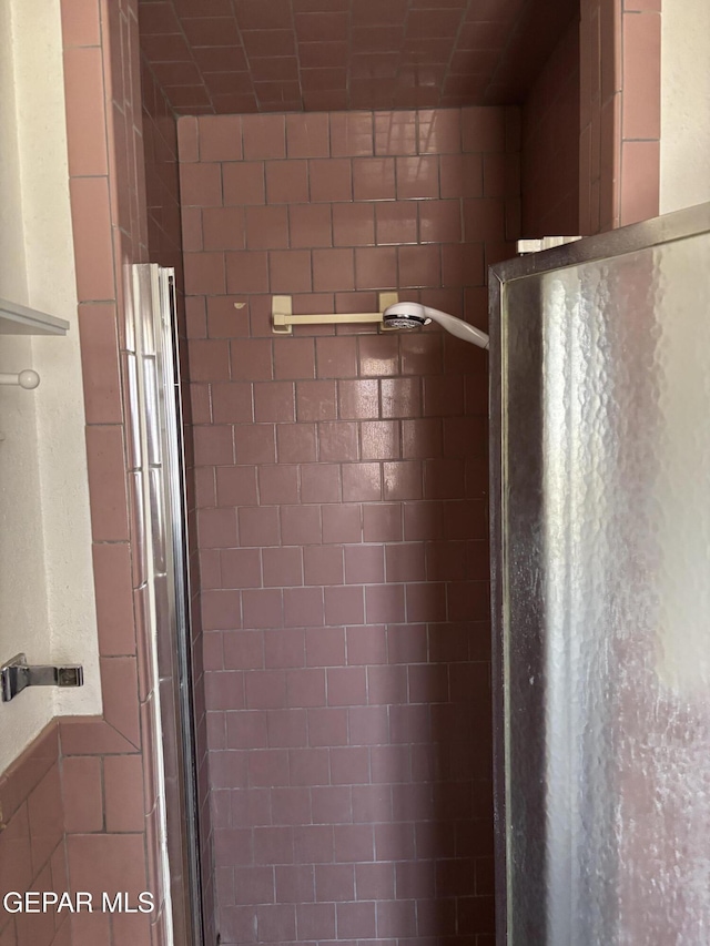 full bathroom featuring a stall shower