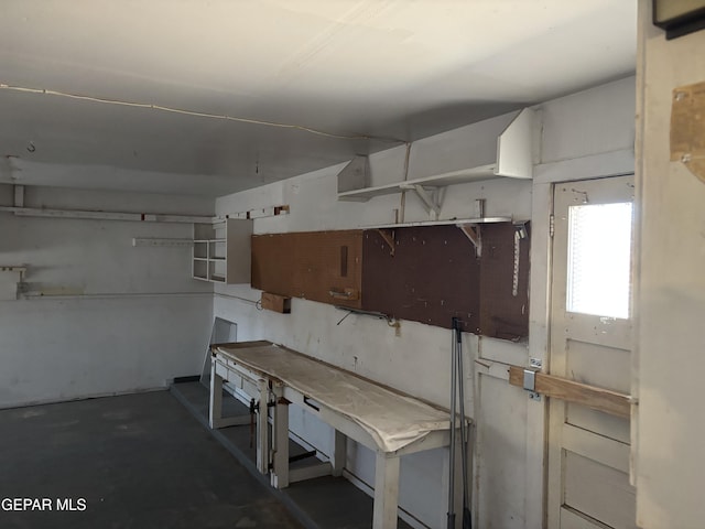 kitchen with concrete flooring and open shelves