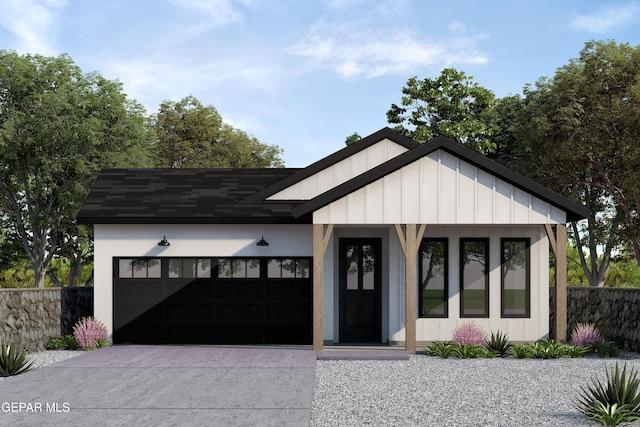 modern farmhouse with driveway, an attached garage, and board and batten siding