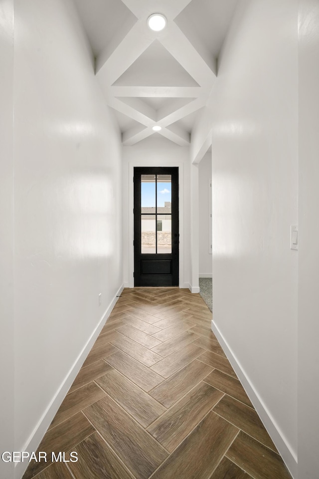 entryway featuring baseboards, coffered ceiling, and beam ceiling