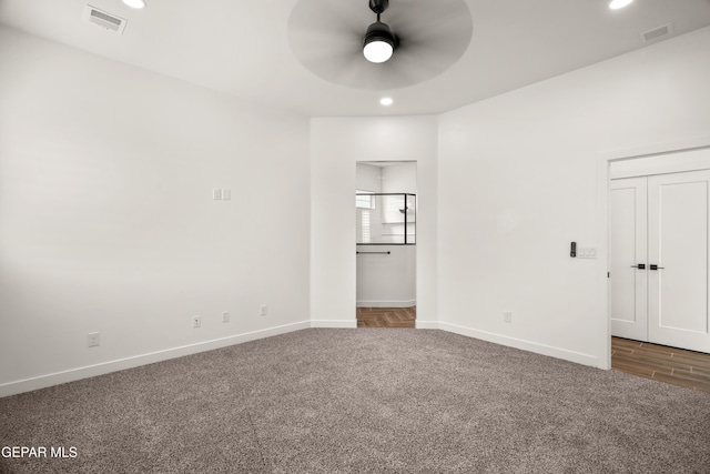 carpeted empty room with recessed lighting, baseboards, visible vents, and ceiling fan