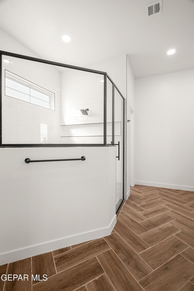 interior space featuring wood finished floors, recessed lighting, visible vents, and baseboards