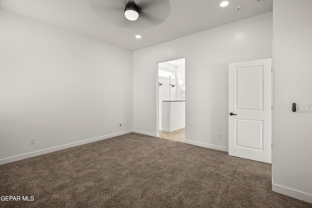 unfurnished bedroom featuring recessed lighting, connected bathroom, baseboards, and carpet flooring