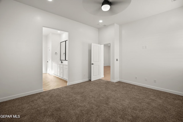 unfurnished bedroom featuring visible vents, ensuite bathroom, recessed lighting, carpet flooring, and baseboards