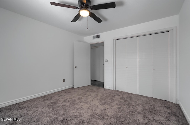 unfurnished bedroom featuring a ceiling fan, visible vents, carpet floors, baseboards, and a closet