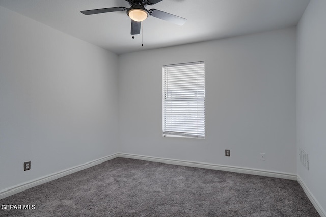 unfurnished room featuring a ceiling fan, visible vents, carpet, and baseboards