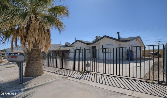 view of gate featuring a fenced front yard