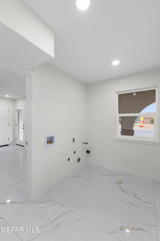 washroom featuring gas dryer hookup, washer hookup, laundry area, marble finish floor, and hookup for an electric dryer