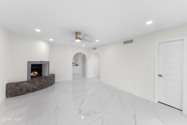 unfurnished living room featuring recessed lighting, visible vents, marble finish floor, and ceiling fan