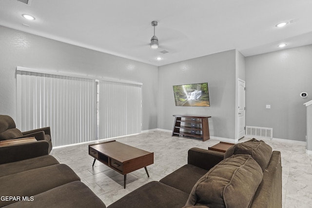 living room featuring visible vents, baseboards, ceiling fan, recessed lighting, and marble finish floor