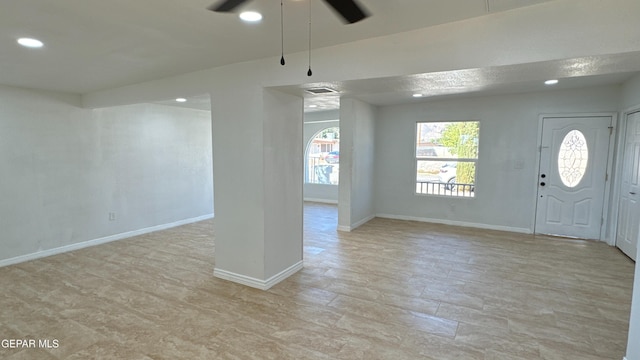 foyer entrance with recessed lighting, baseboards, and ceiling fan