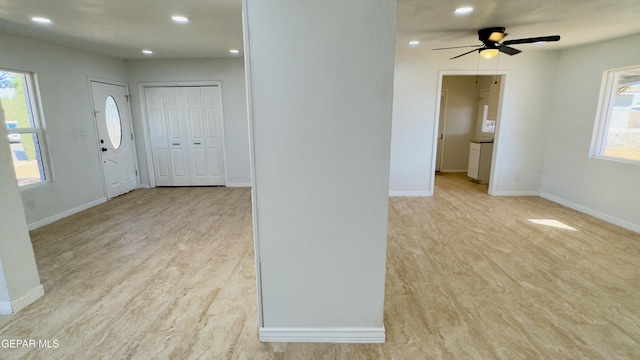 interior space with recessed lighting, baseboards, a healthy amount of sunlight, and a ceiling fan