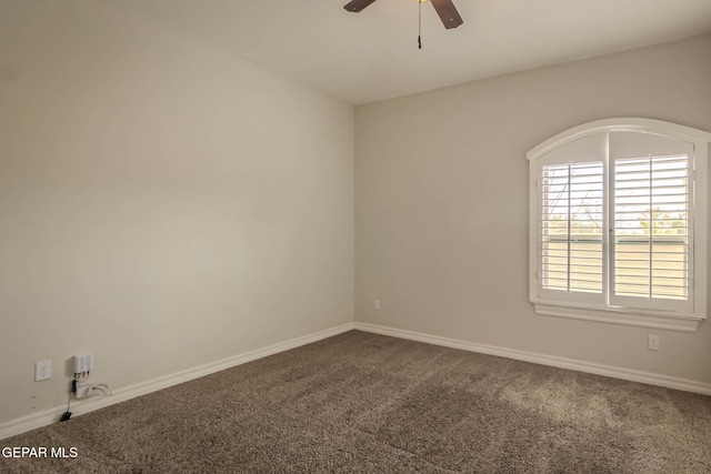 carpeted empty room with baseboards and ceiling fan