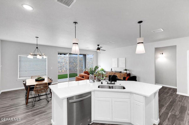 kitchen with visible vents, open floor plan, light countertops, stainless steel dishwasher, and a sink