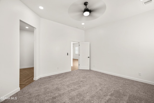 carpeted spare room with visible vents, recessed lighting, baseboards, and ceiling fan