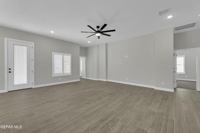 unfurnished living room with visible vents, recessed lighting, a ceiling fan, and wood finished floors