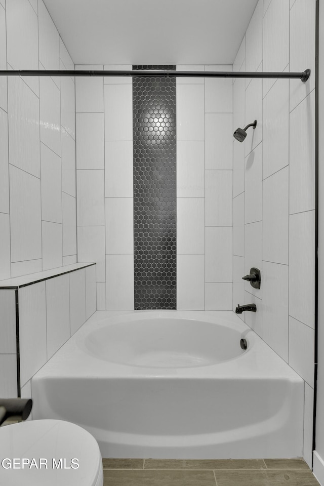 full bath with toilet and shower / bath combination