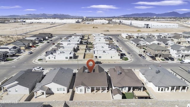 drone / aerial view featuring a mountain view and a residential view