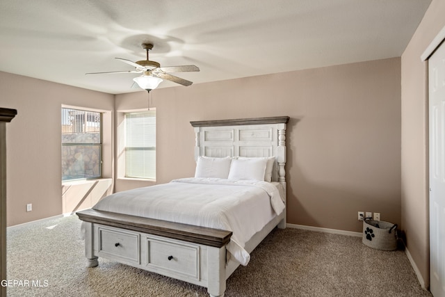 bedroom with baseboards, carpet, and a ceiling fan