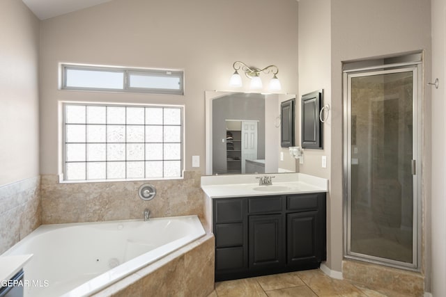 full bathroom featuring tile patterned floors, a shower stall, vanity, and a whirlpool tub