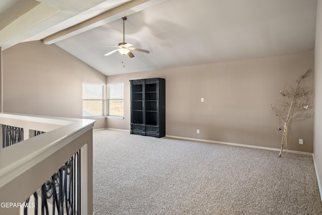 unfurnished bedroom featuring lofted ceiling with beams, carpet, baseboards, and ceiling fan