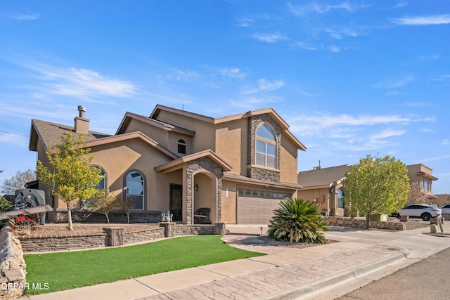 view of front facade with an attached garage, a front yard, stucco siding, stone siding, and driveway