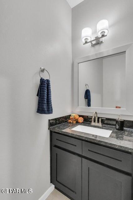 bathroom featuring vanity and baseboards