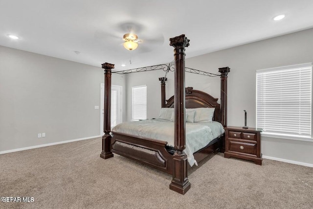 bedroom featuring recessed lighting, baseboards, and light carpet