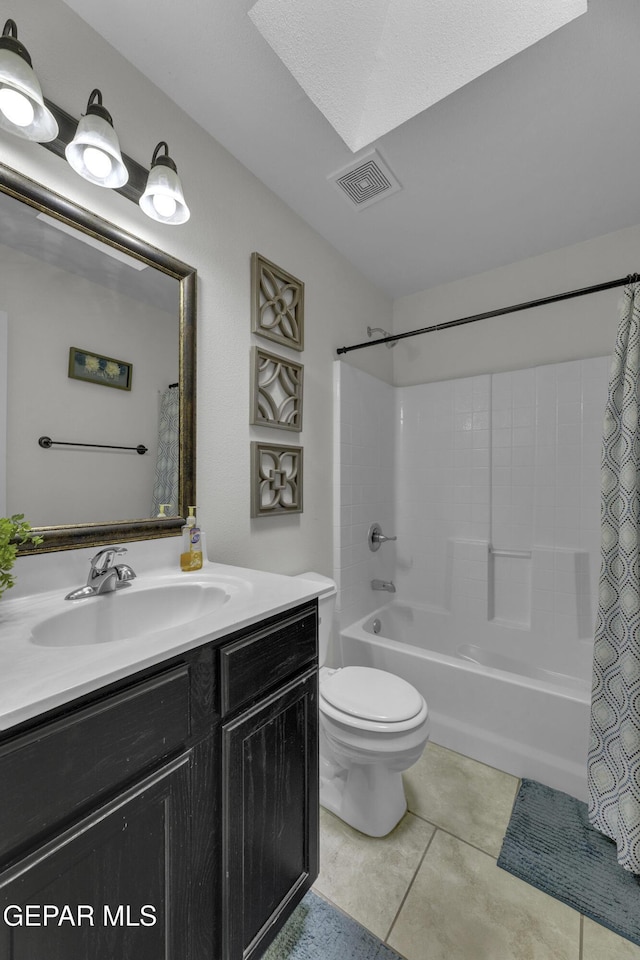 full bath with visible vents, toilet, shower / tub combo, tile patterned floors, and vanity