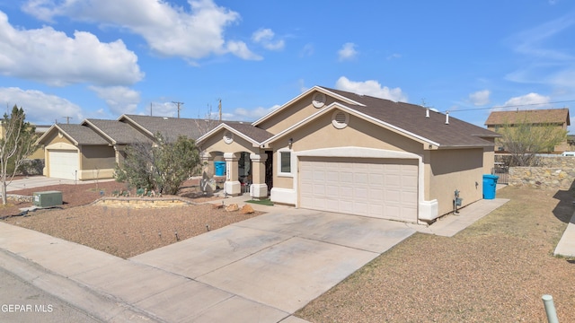 ranch-style home with stucco siding, a garage, and concrete driveway