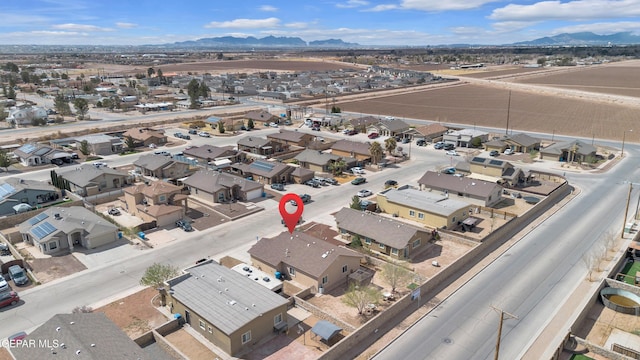 drone / aerial view with a residential view and a mountain view