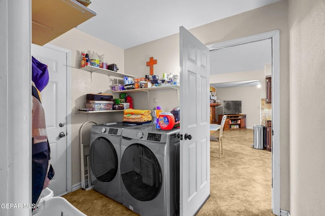 washroom with laundry area and separate washer and dryer