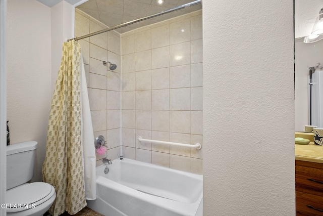 bathroom with a textured wall, toilet, vanity, and shower / bath combination with curtain