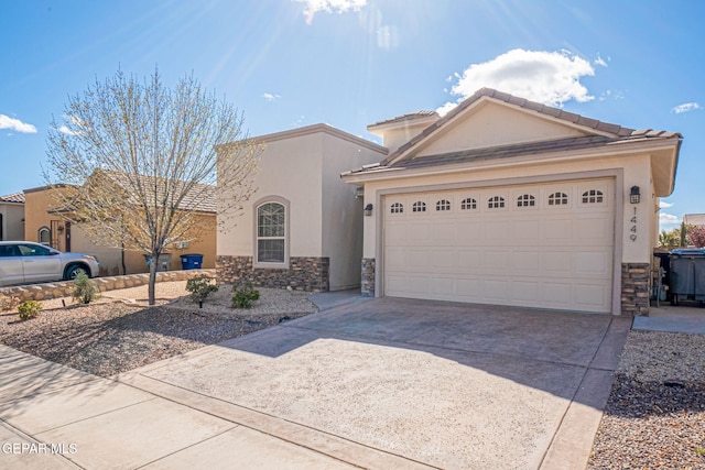 view of front of property featuring a garage, stone siding, driveway, and stucco siding