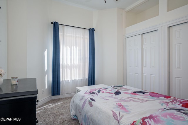 bedroom featuring a closet and light colored carpet