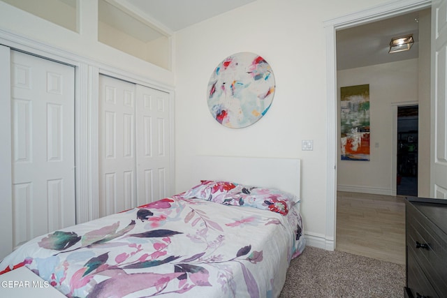 carpeted bedroom with baseboards