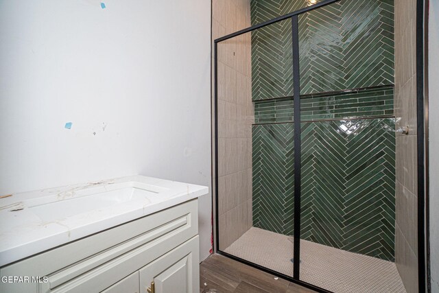 bathroom featuring vanity and a stall shower