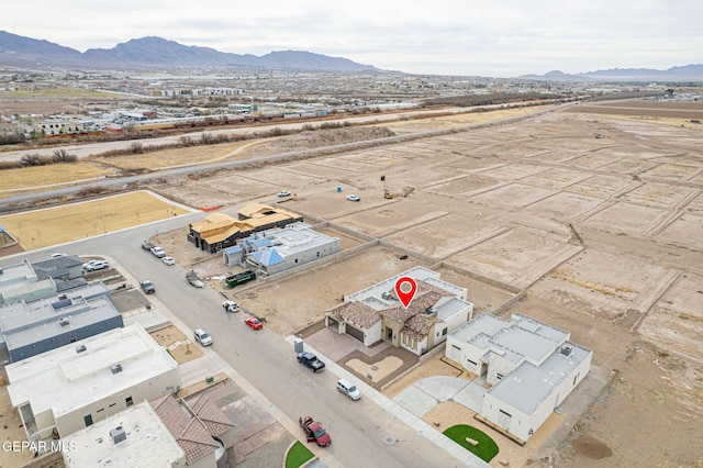 drone / aerial view featuring a mountain view