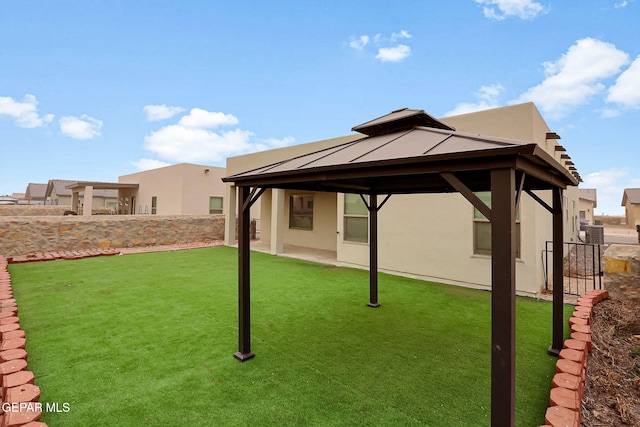 view of yard with a gazebo and central AC unit